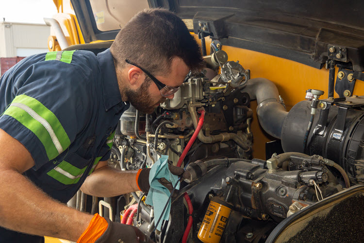 Shop technicians use the latest diagnostic equipment to repair customer machines.